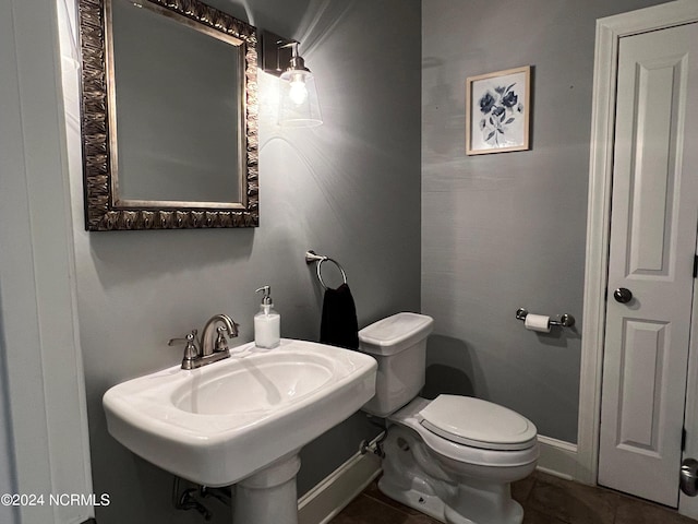 bathroom with toilet and sink