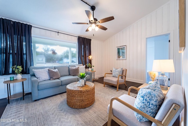 living room with ceiling fan and hardwood / wood-style flooring