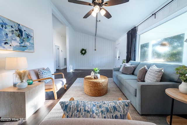 living room featuring ceiling fan and hardwood / wood-style floors