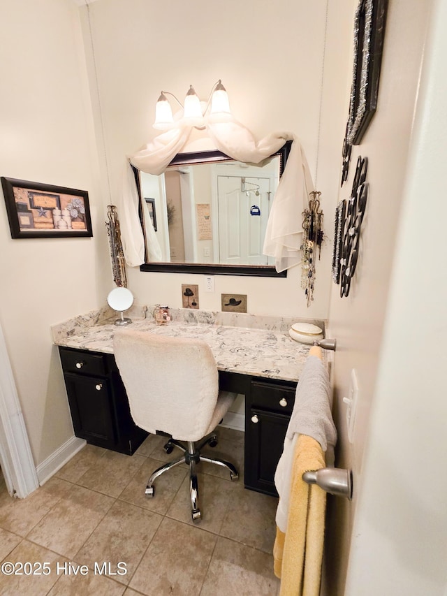 bathroom with vanity and tile patterned floors