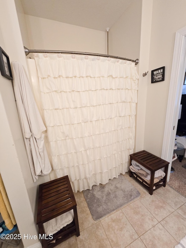 bathroom with tile patterned flooring