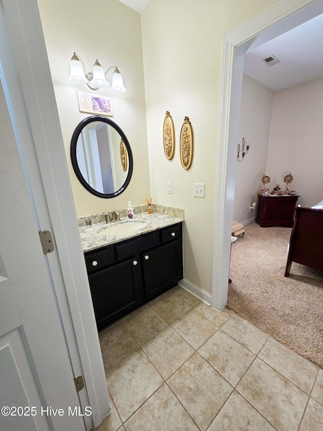 bathroom featuring tile patterned flooring and vanity