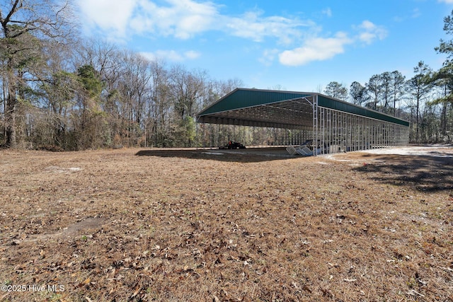 view of yard with a carport