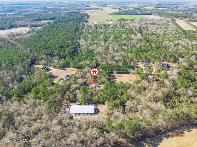 birds eye view of property with a rural view and a view of trees
