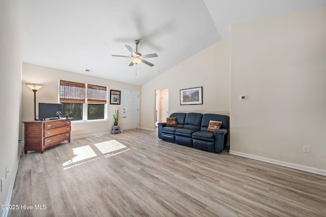 living room featuring lofted ceiling, light wood finished floors, visible vents, a ceiling fan, and baseboards