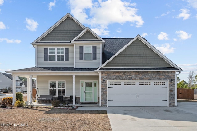 view of front facade with a garage and a porch