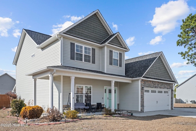 view of front facade featuring a porch and a garage