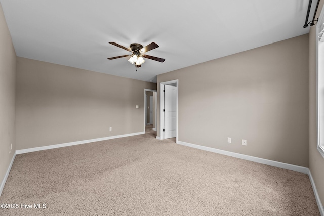 402 Kinroff Dr, Hubert, NC 28539 - spare room featuring a ceiling fan, baseboards, and carpet