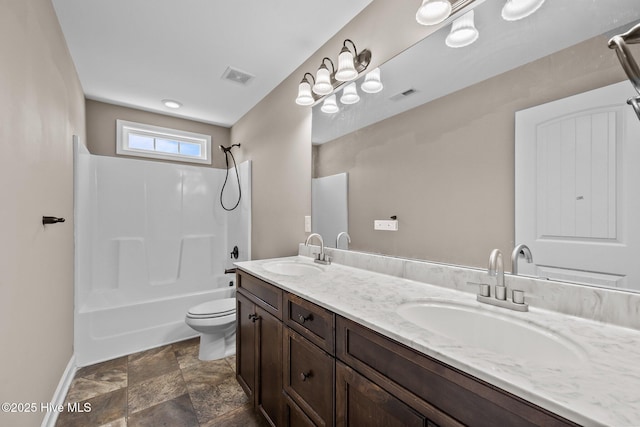 402 Kinroff Dr, Hubert, NC 28539 - full bath featuring toilet, double vanity, tub / shower combination, stone finish flooring, and baseboards