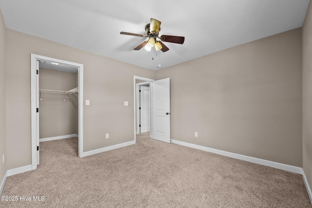 402 Kinroff Dr, Hubert, NC 28539 - unfurnished bedroom featuring carpet flooring, baseboards, a spacious closet, a closet, and a ceiling fan