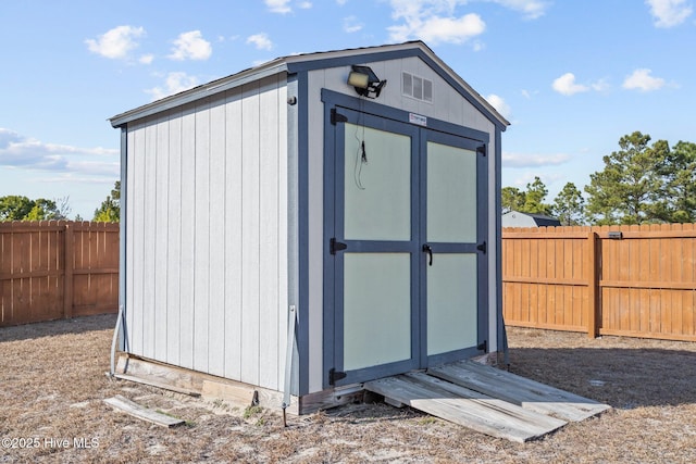 402 Kinroff Dr, Hubert, NC 28539 - view of shed with a fenced backyard