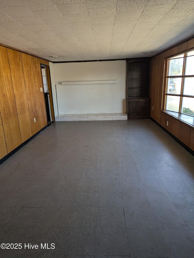 empty room with wooden walls