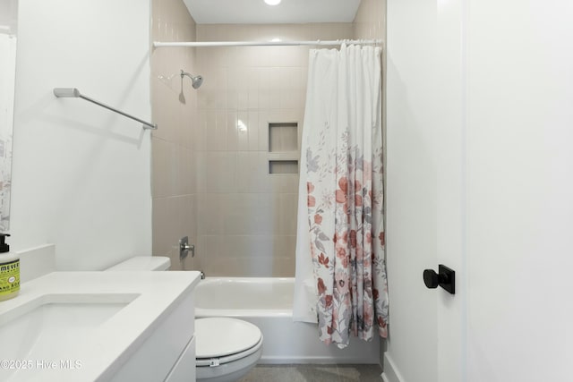 full bathroom featuring vanity, shower / tub combo with curtain, and toilet