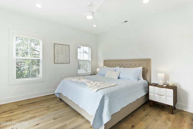 bedroom featuring ceiling fan and light wood-type flooring