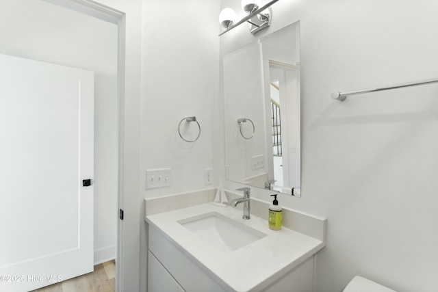 bathroom featuring vanity and hardwood / wood-style floors