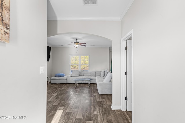 corridor with dark hardwood / wood-style floors and ornamental molding