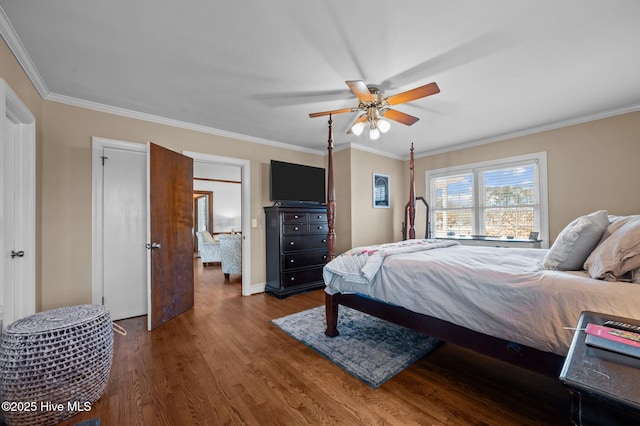 bedroom with dark hardwood / wood-style flooring, ceiling fan, and ornamental molding