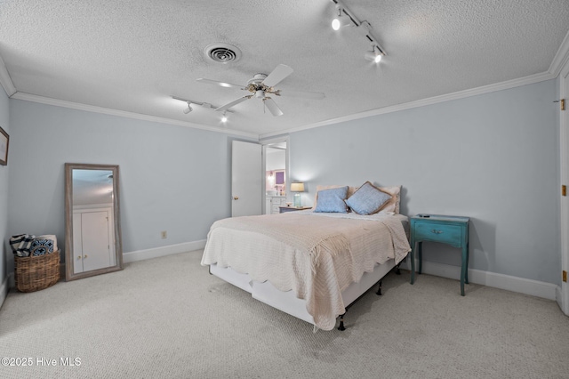 bedroom with rail lighting, ceiling fan, ornamental molding, and light carpet