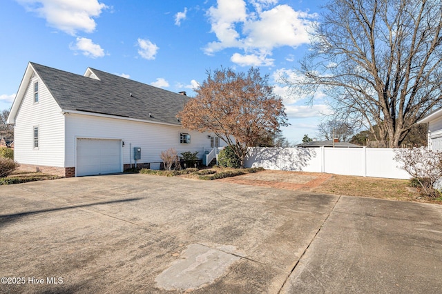 view of property exterior featuring a garage