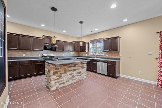 kitchen with pendant lighting, dark brown cabinets, stainless steel appliances, light tile patterned flooring, and decorative backsplash