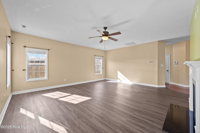 spare room featuring dark hardwood / wood-style floors and ceiling fan