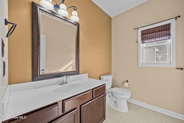 bathroom with vanity, tile patterned floors, and toilet