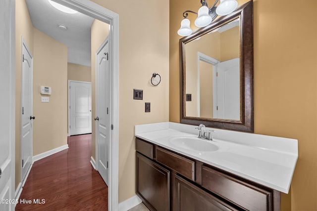 bathroom featuring hardwood / wood-style flooring and vanity