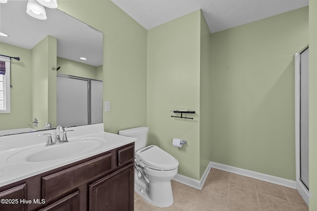 bathroom featuring vanity, an enclosed shower, tile patterned floors, and toilet