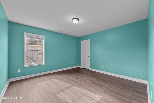 empty room featuring light hardwood / wood-style floors