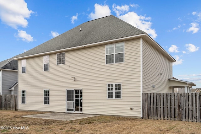 back of house featuring a yard and a patio