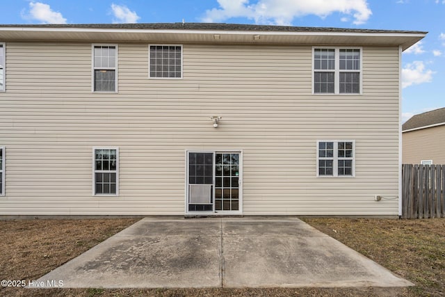 back of property with a patio