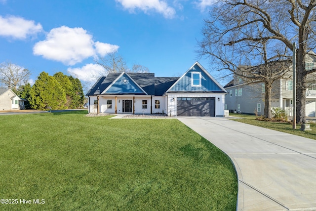 view of front of house with a garage and a front lawn