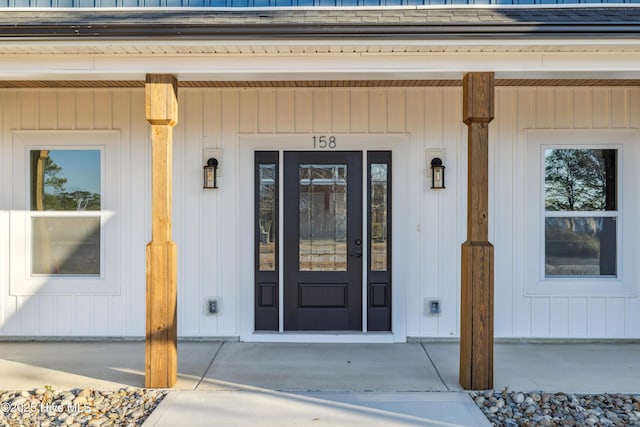 property entrance featuring covered porch