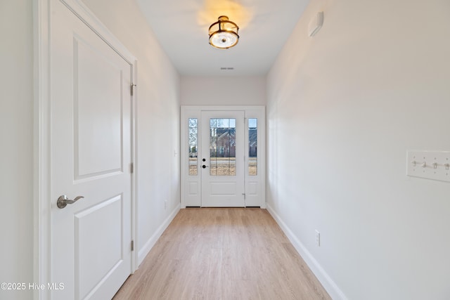 doorway to outside with light hardwood / wood-style flooring