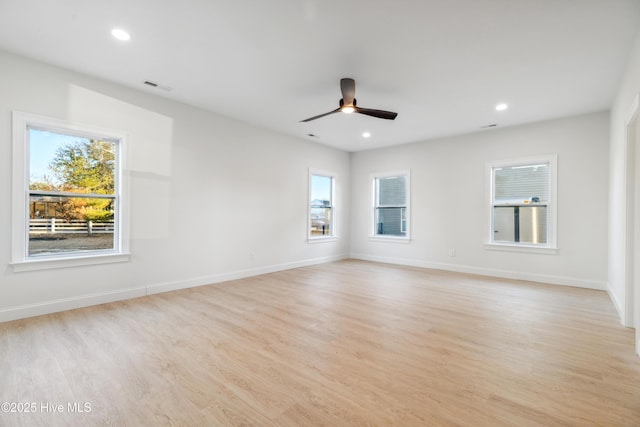 empty room with light hardwood / wood-style floors and ceiling fan