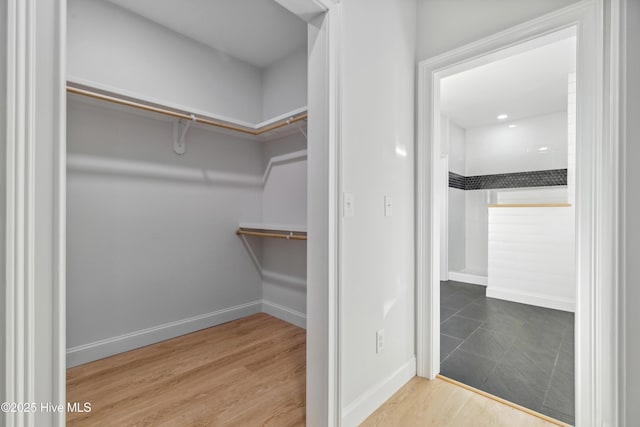 walk in closet featuring hardwood / wood-style floors