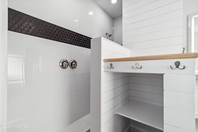 bathroom with a tile shower