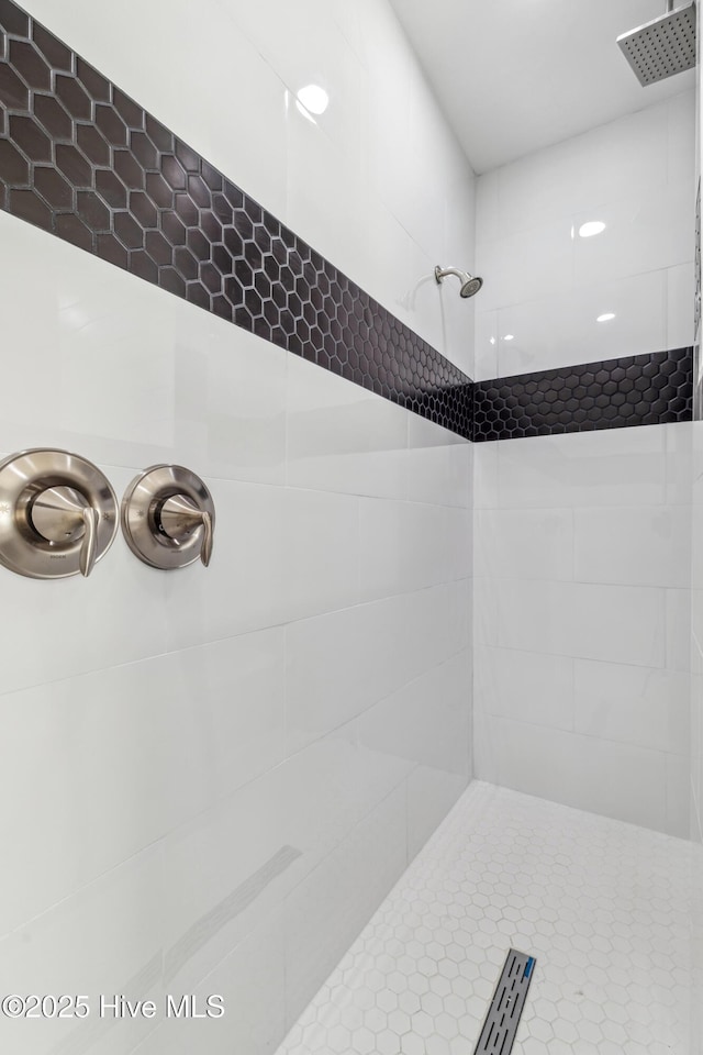 bathroom with a tile shower