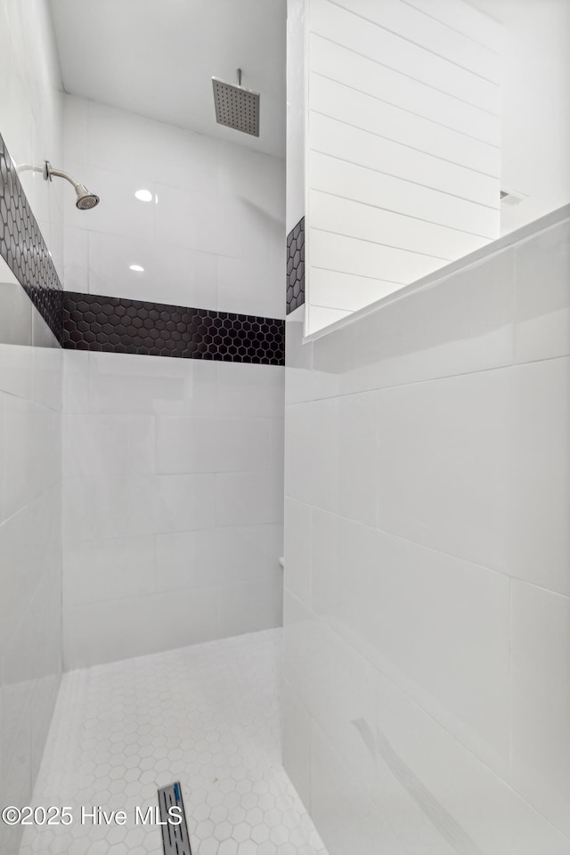 bathroom with a tile shower