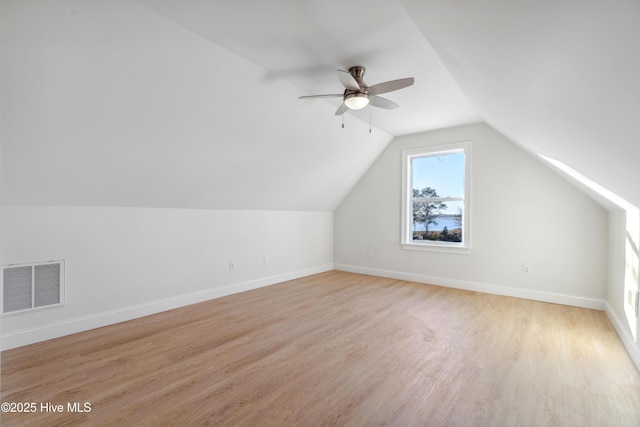 additional living space featuring ceiling fan, lofted ceiling, and light hardwood / wood-style floors