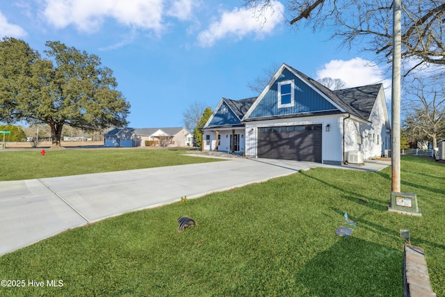 view of front of home featuring a garage and a front lawn