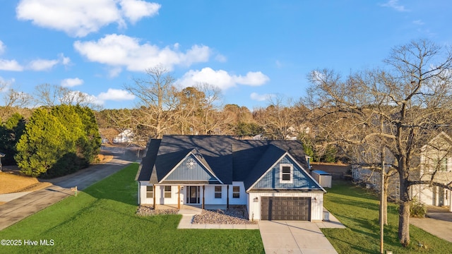 view of front of home with a garage and a front lawn