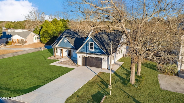 view of front of property with a garage and a front lawn