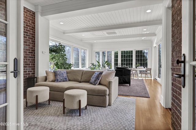 sunroom with beam ceiling