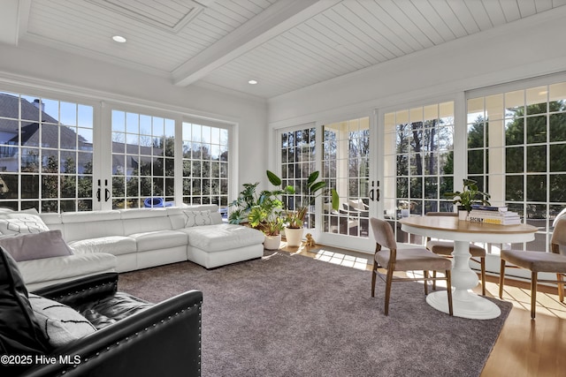 sunroom / solarium featuring french doors, beamed ceiling, and wooden ceiling