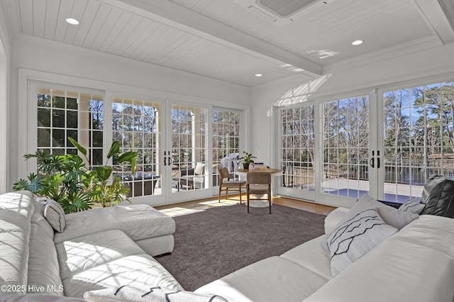 sunroom / solarium featuring french doors and beam ceiling