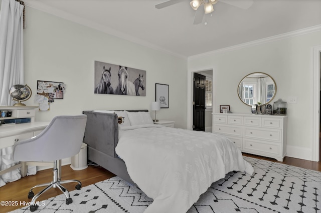 bedroom with ornamental molding, hardwood / wood-style flooring, and ceiling fan