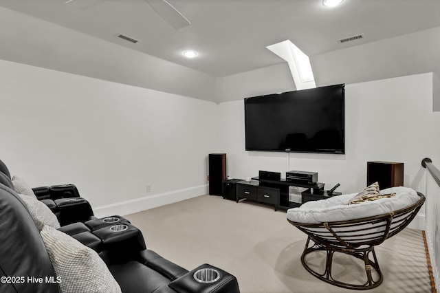 living room with carpet flooring and a skylight