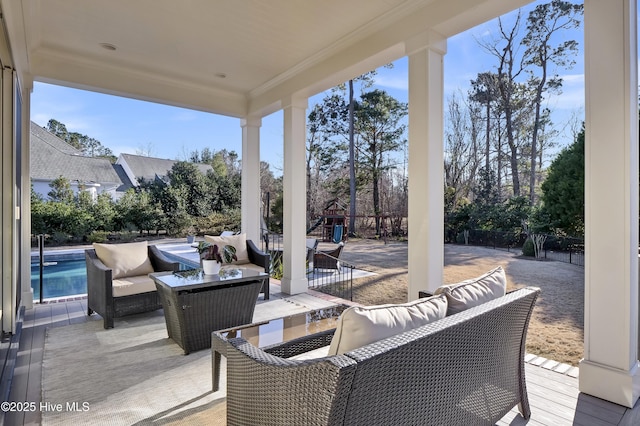 view of patio featuring a playground and an outdoor hangout area