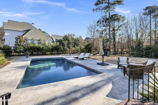 view of pool featuring a patio